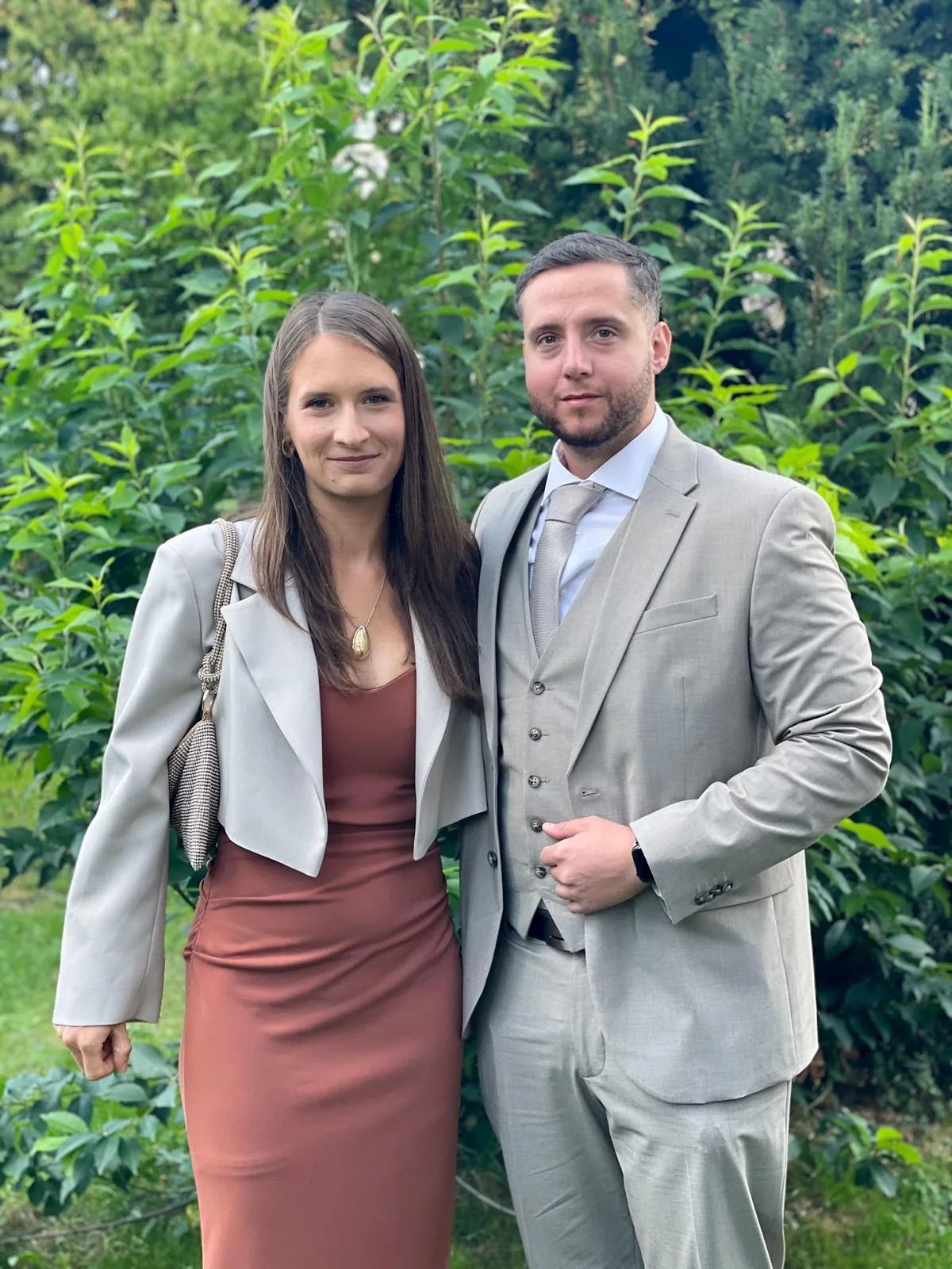 Anna and Mihael standing together in a garden